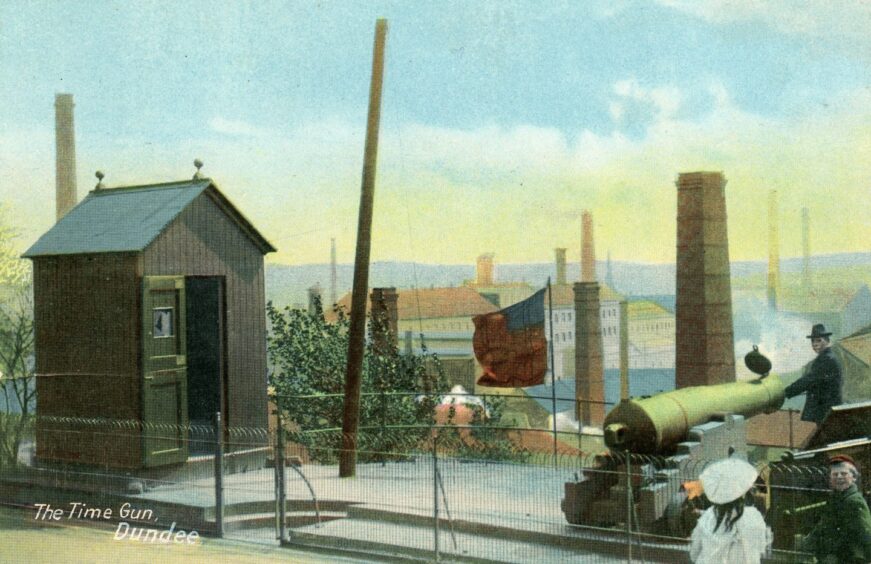 Two children look on as the one O'clock gun is fired in this Dundee postcard