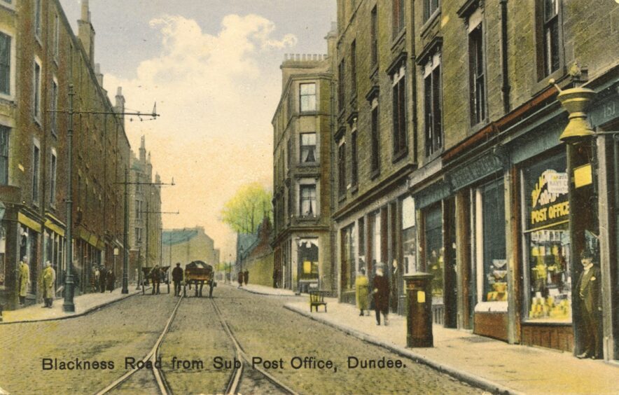 a horse and cart goes down the middle of the road in this postcard of Blackness Road. 
