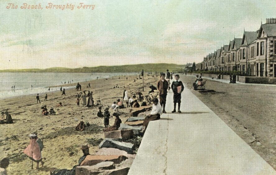 people on the beach and two boys walking on Broughty Ferry esplanade
